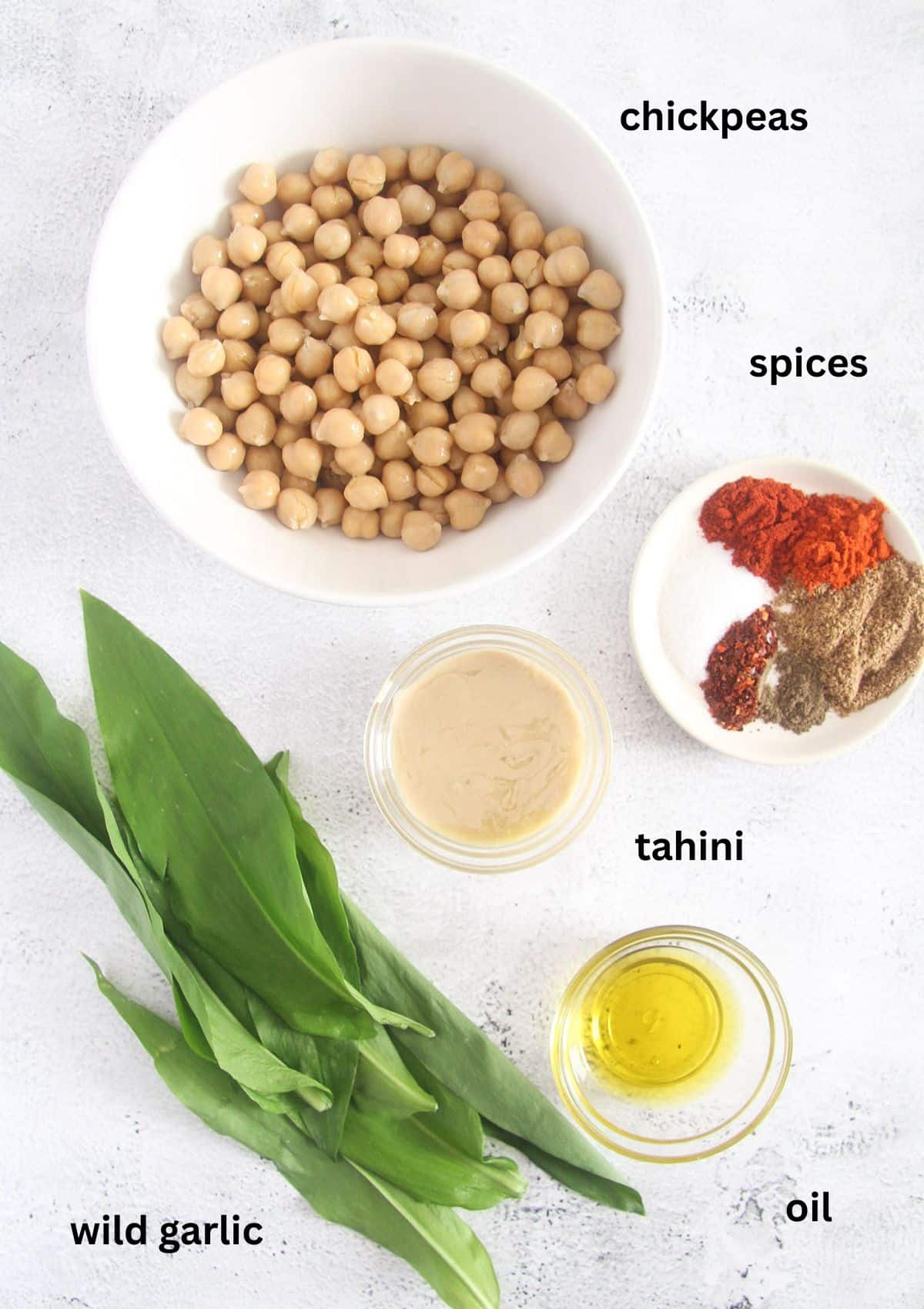 labeled ingredients for making wild garlic hummus.