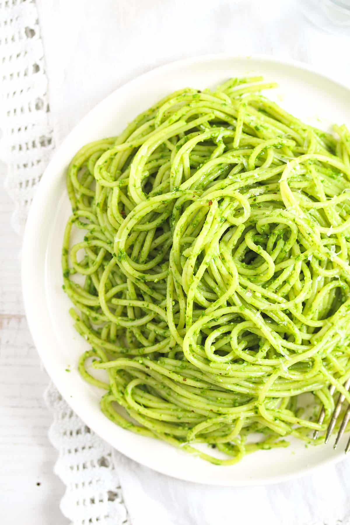 tangled spaghetti with wild garlic pesto on a plate.
