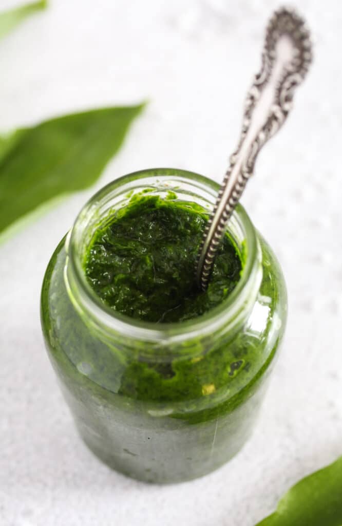 ramsons paste in a small jar on the table.