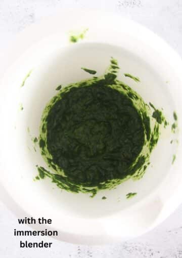 wild garlic paste made in a bowl with an immersion blender.