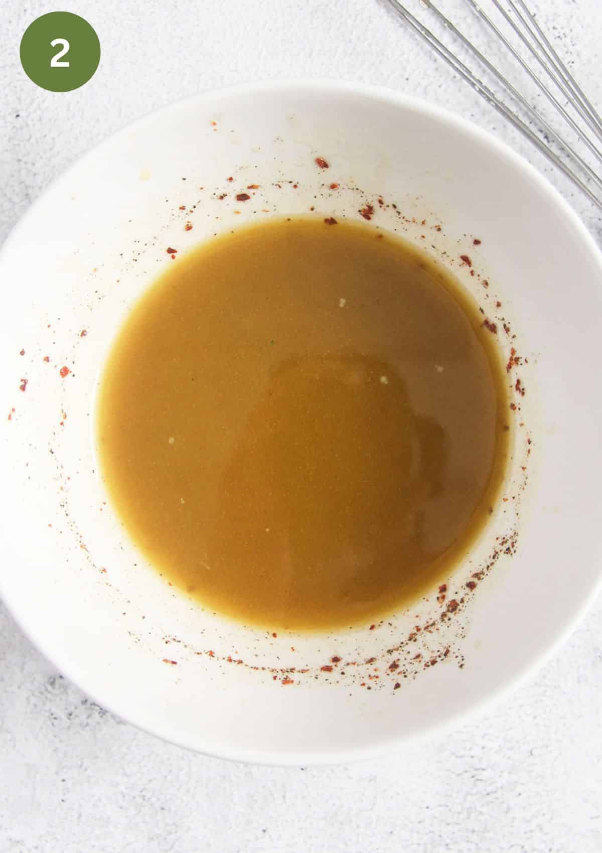 mixed olive oil, vinegar, seasoning, and water to make sauce in a small bowl.