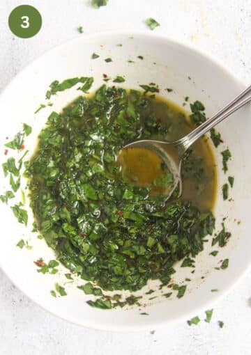 stirring chopped wild garlic and parsley into olive oil with a spoon.