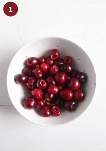 bowl with freshly pitted cherries.