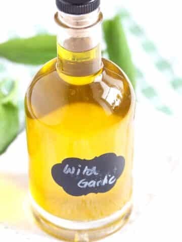 small labeled bottle of wild garlic oil.