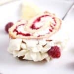 slice of raspberry roulade on a plate.
