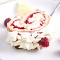 slice of raspberry roulade on a plate.
