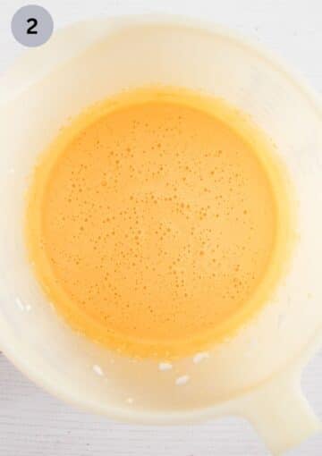 beaten egg yolks and sugar in a bowl.