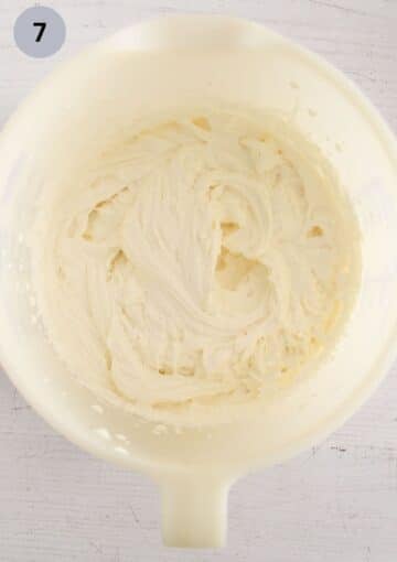 mascarpone filling for raspberry roulade in a bowl.