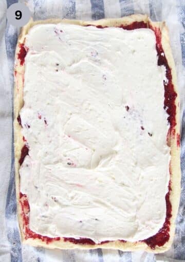 covering a roulade cake sheet with raspberry filling and mascarpone.