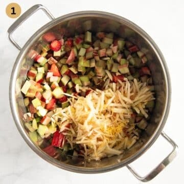 chopped rhubarb, strawberries and grated apples in a pot to make jam.