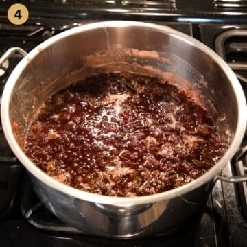strawberry rhubarb jam without pectin cooking in a large pot.