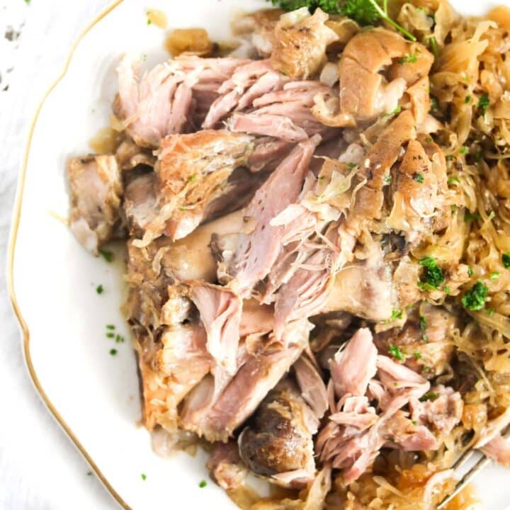 shredded soft meat served with kraut close up.