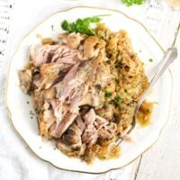 plate with slow cooked pork hocks served with sauerkraut.