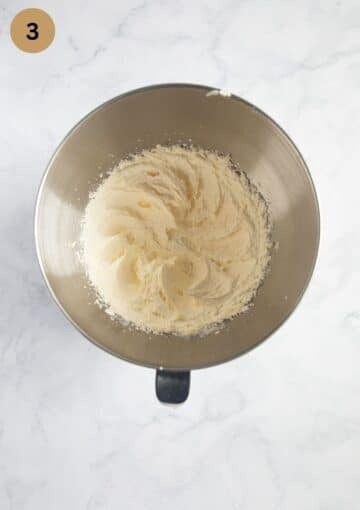 creamed butter and sugar for cake in a bowl.
