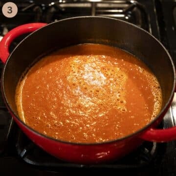 blended tomato soup in a large red dutch oven.