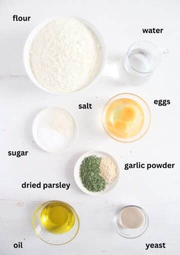 labeled ingredients for making the dough for wild garlic bread.