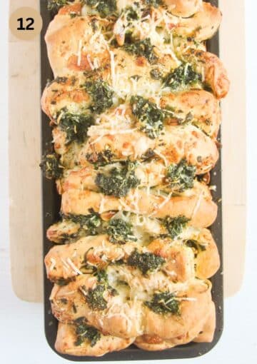 baked loaf of wild garlic bread in a loaf pan.