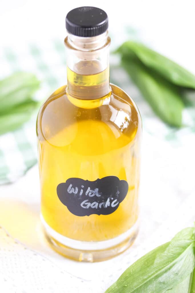 herb oil in a small bottle on the table.