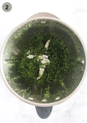 mixing salt and wild garlic in a food processor.