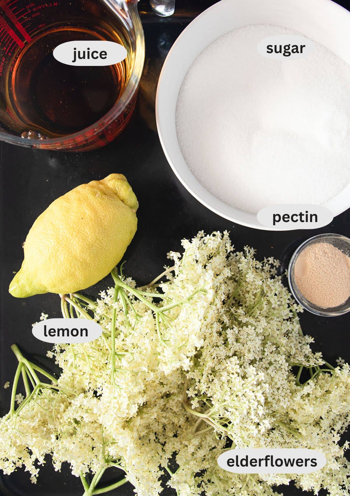labeled ingredients for making elderflower jam.