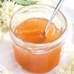 elderflower jelly with apple juice in a small jar.
