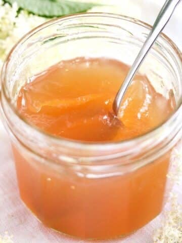 elderflower jelly with apple juice in a small jar.