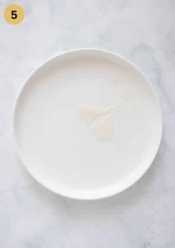 making jelly test for elderflower jelly on a small white plate.