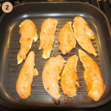 chicken tenders cooking in a grill pan.
