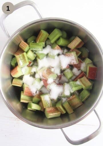 chopped rhubarb and sugar in a pot to make custard.