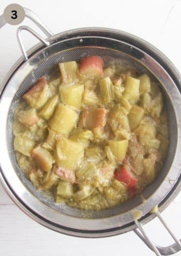 straining cooked rhubarb through a sieve.