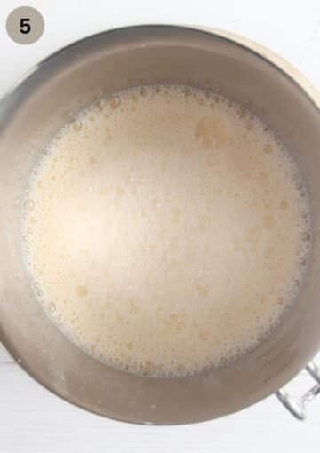 foamy egg mixture for making rhubarb custard in a large bowl.