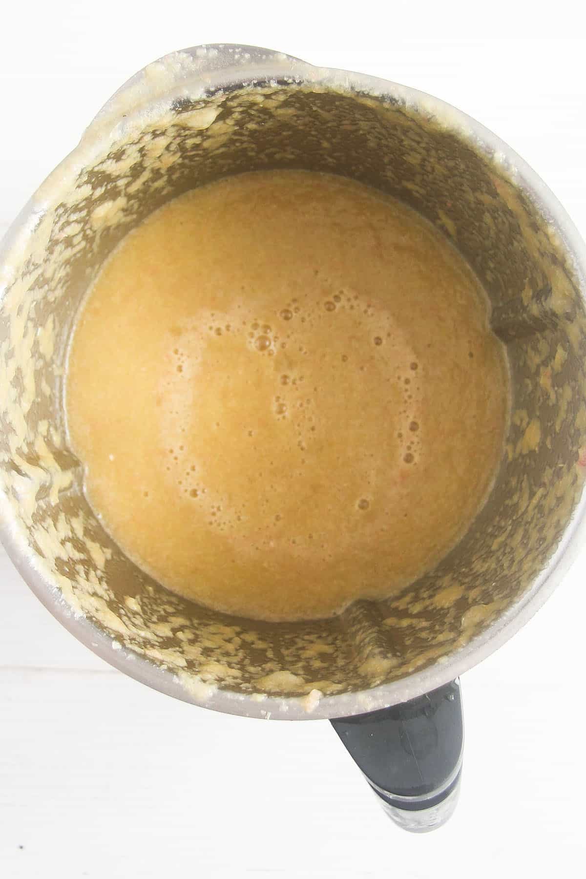 blended oranges and rhubarb for making jam in a food processor.