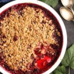 pinterest image of berry crisp in a baking dish.
