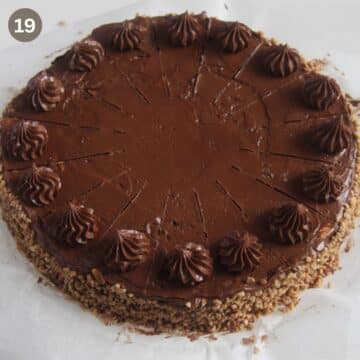 decorating dobos torte with chocolate rosettes.