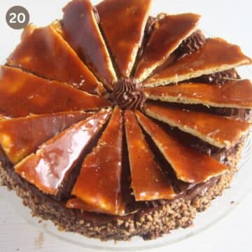adding caramel wedges on top of dobos torte.