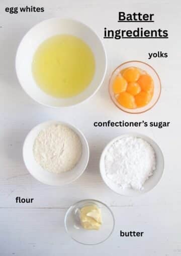 ingredients for dobos torte batter: egg whites, yolks, icing sugar, butter, flour.
