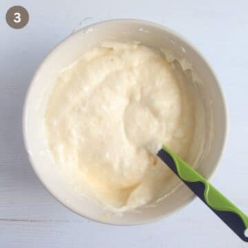 folding egg whites into egg yolk with a spatula.