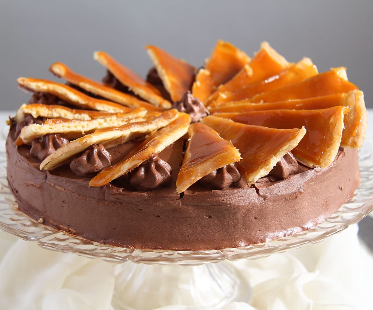 dobos torte garnished with caramel slices.