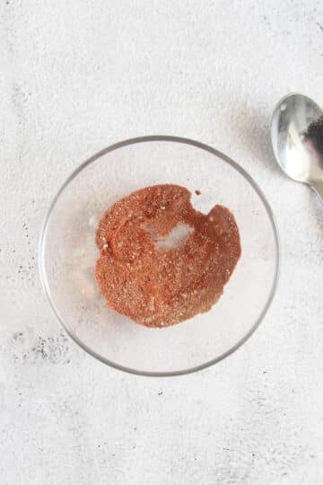 seasoning for pork belly strips in a small bowl.