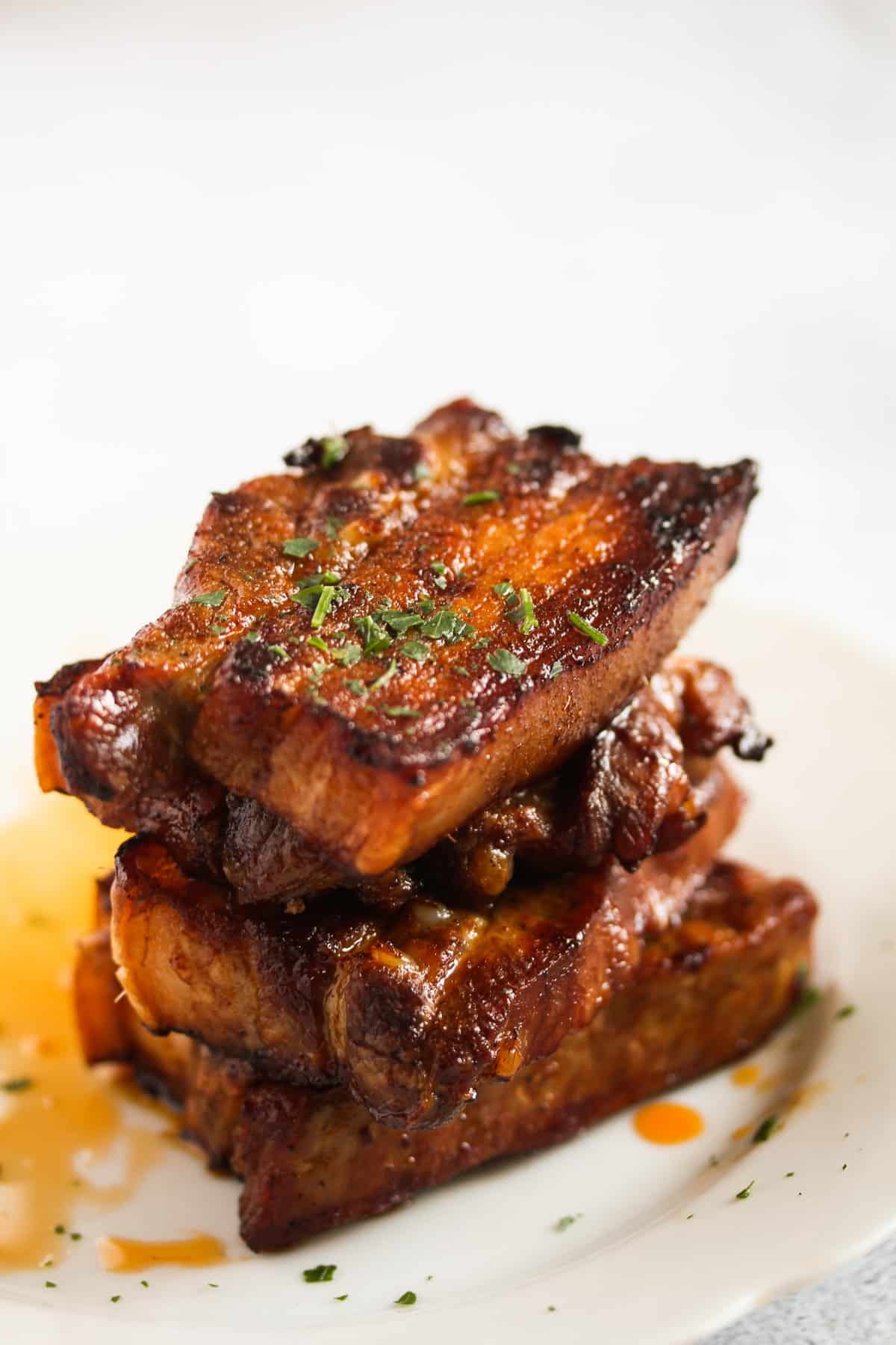 a staple of pork belly slices on a plate. 