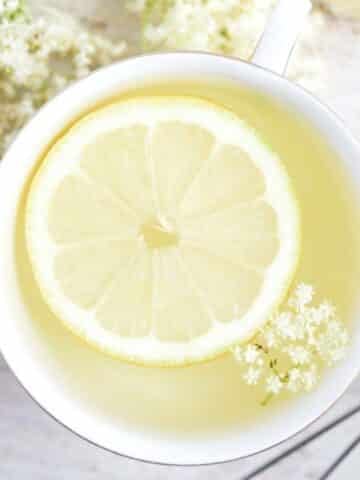 elderflower tea with lemon slice inside it.