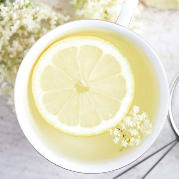 elderflower tea with lemon slice inside it.