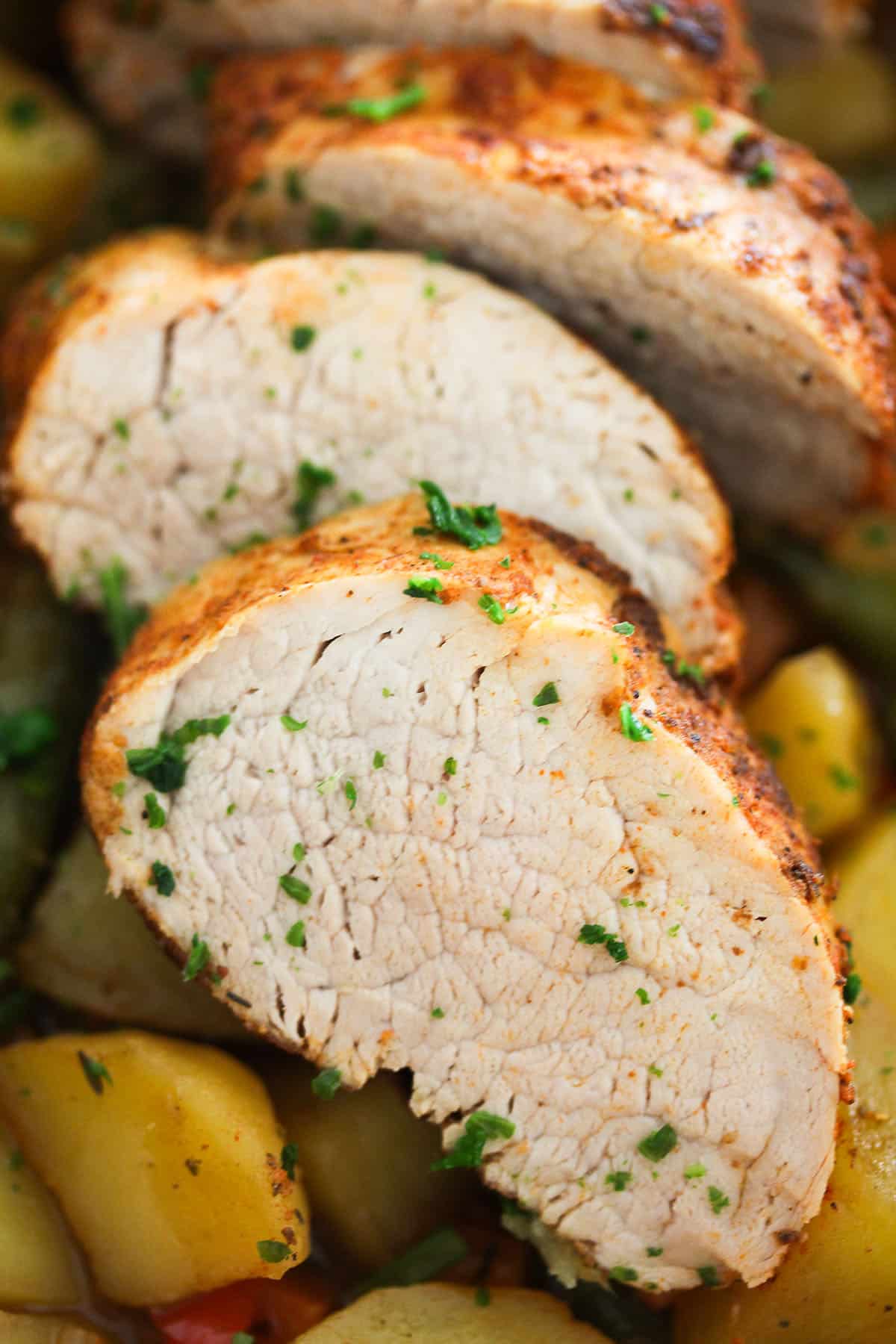 juicy slices of pork tenderloin sprinkled with parsley.