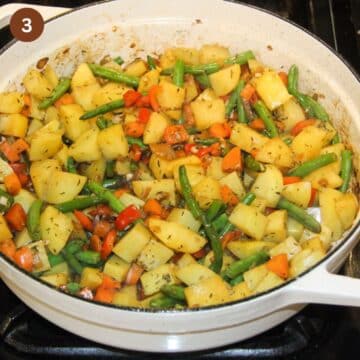 potato pieces, green beans, chopped carrots and bell peppers in a large pot.