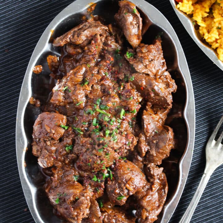 chicken livers with spices on a small platter.