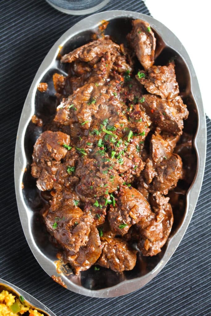 silver plattter with spicy chicken livers cooked nando style.