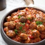 pinterest image with the title spanish meatballs.