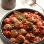 pin image with the title the best spanish meatballs.