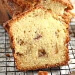 peach cobbler bread sliced on a rack.