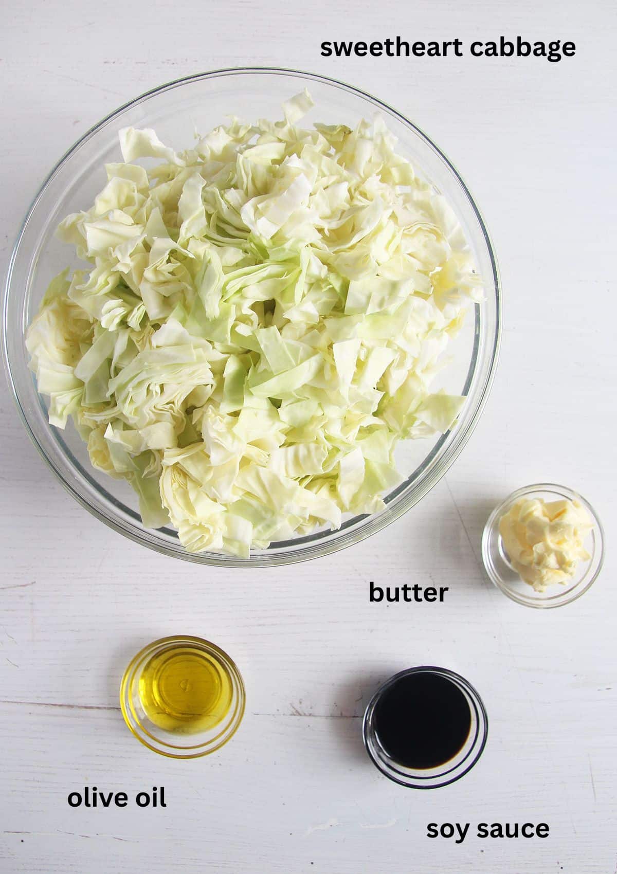 labeled ingredients for cooking sweetheart cabbage with butter, oil and soy sauce.